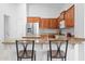 Kitchen features granite countertops, stainless steel appliances, and wood cabinets at 4976 S Sugarberry Ln, Gilbert, AZ 85298