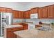 Kitchen features granite countertops, stainless steel appliances, and wood cabinets at 4976 S Sugarberry Ln, Gilbert, AZ 85298