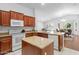 Bright kitchen features stainless appliances, wood cabinets, and granite countertops at 4976 S Sugarberry Ln, Gilbert, AZ 85298