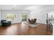 Inviting living space featuring hardwood floors, a dining area, and a seamless flow to the outdoor patio at 4976 S Sugarberry Ln, Gilbert, AZ 85298