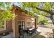 Relaxing covered patio area, ideal for outdoor dining and entertaining with comfortable seating at 4976 S Sugarberry Ln, Gilbert, AZ 85298