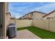 A backyard with artificial turf, brick pavers, and a brick wall fence at 5253 E Hilton Ave, Mesa, AZ 85206