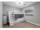 Bedroom featuring a bunk bed with storage, carpet flooring, and a ceiling fan at 5253 E Hilton Ave, Mesa, AZ 85206