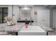 Granite kitchen island with white sink and stainless faucet; modern interior design at 5253 E Hilton Ave, Mesa, AZ 85206