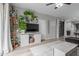 Comfortable living room featuring stylish decor, wood-look flooring, and plenty of plants at 5253 E Hilton Ave, Mesa, AZ 85206
