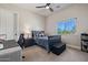 Well-lit bedroom with ceiling fan, a bed, and a window overlooking the outdoors at 5515 E Dale Ln, Cave Creek, AZ 85331