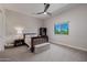 Cozy bedroom with a ceiling fan, and large window offering a view of the outside at 5515 E Dale Ln, Cave Creek, AZ 85331