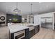 Spacious kitchen featuring a large island, stainless steel appliances, and a connected living area at 5515 E Dale Ln, Cave Creek, AZ 85331
