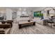 Bright living space with comfortable seating, modern lighting, and a seamless transition to the kitchen and outdoor pool area at 5515 E Dale Ln, Cave Creek, AZ 85331
