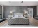 Bedroom showcasing decorative wall, neutral tones, and adjacent bathroom entrance at 5515 E Dale Ln, Cave Creek, AZ 85331