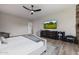 Bedroom displaying a TV, dresser, and workout equipment for convenience at 5515 E Dale Ln, Cave Creek, AZ 85331