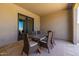 Outdoor dining area with a stone table, seating for six, and neutral colors perfect for outdoor living at 5515 E Dale Ln, Cave Creek, AZ 85331