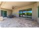 Covered patio with tiled flooring and outdoor dining table, with view of the pool at 5515 E Dale Ln, Cave Creek, AZ 85331