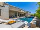 Gorgeous backyard with a luxurious pool, integrated spa, and inviting lounge chairs for ultimate relaxation at 5515 E Dale Ln, Cave Creek, AZ 85331