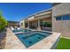 Luxurious outdoor living with a sparkling pool, integrated spa, and seamless transition from indoor to outdoor at 5515 E Dale Ln, Cave Creek, AZ 85331