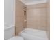 Close up on a bathroom featuring a tiled shower-tub combo and toilet at 556 N Hobson Plz, Mesa, AZ 85203