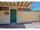 View of the front door of the house that is painted green at 556 N Hobson Plz, Mesa, AZ 85203
