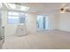 Open kitchen with stainless steel appliances, sink, and a large window at 556 N Hobson Plz, Mesa, AZ 85203