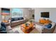 Inviting living room with hardwood floors, comfortable seating, and natural light, perfect for relaxation and entertainment at 556 N Hobson Plz, Mesa, AZ 85203