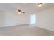 Spacious living room with ceiling fan and open entry to a bedroom at 556 N Hobson Plz, Mesa, AZ 85203
