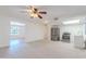Bright, open living room with ceiling fan, stainless steel appliances and lots of natural light at 556 N Hobson Plz, Mesa, AZ 85203