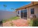 Exterior patio with sliding glass door and concrete pavers at 556 N Hobson Plz, Mesa, AZ 85203