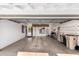 Spacious garage with ample storage, concrete floors and bright lighting fixtures, ready for customization at 5633 E Colby St, Mesa, AZ 85205