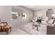 Bright living room featuring a large window, tile flooring, and comfortable seating arrangements at 5633 E Colby St, Mesa, AZ 85205