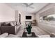 Inviting living room with comfortable furniture, natural light, and a ceiling fan at 5633 E Colby St, Mesa, AZ 85205
