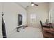 Bonus room with a ceiling fan, a window, an exercise machine and a desk with a computer at 5810 E Nora St, Mesa, AZ 85215