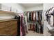 Walk-in closet equipped with built-in shelving and rods for optimal storage at 5810 E Nora St, Mesa, AZ 85215