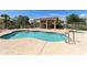 Sparkling community pool with relaxing lounge chairs and a shaded pergola at 5810 E Nora St, Mesa, AZ 85215