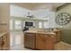 Kitchen features wood cabinets, stainless steel appliances and tile floors at 5810 E Nora St, Mesa, AZ 85215