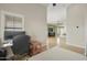 Bright office space with wood floors, neutral walls, and a large window offering natural light at 5810 E Nora St, Mesa, AZ 85215