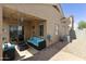 Cozy covered patio with ample seating, offering a relaxing outdoor living space at 5810 E Nora St, Mesa, AZ 85215