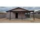 Home exterior featuring a covered patio area, offering a relaxing outdoor space at 719 E Broadway Ave, Apache Junction, AZ 85119