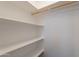 Walk-in closet featuring shelving and a hanging rod for organized storage space at 719 E Broadway Ave, Apache Junction, AZ 85119