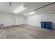 Spacious garage with room for parking, storage, and equipped with a hot water heater at 719 E Broadway Ave, Apache Junction, AZ 85119