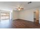 Spacious living room with wood floors leads to patio for seamless indoor-outdoor living at 719 E Broadway Ave, Apache Junction, AZ 85119