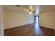 Large living room featuring wood-look floors and neutral-toned walls at 719 E Broadway Ave, Apache Junction, AZ 85119