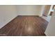 Living room with wood-look floors and neutral-toned walls at 719 E Broadway Ave, Apache Junction, AZ 85119