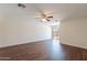 Spacious living room with wood flooring and ceiling fan, plenty of natural light at 719 E Broadway Ave, Apache Junction, AZ 85119