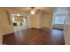 Open-concept living area showcasing wood-look floors and seamless flow into the kitchen at 719 E Broadway Ave, Apache Junction, AZ 85119