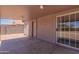 Covered patio with door to the house and a sliding glass door for access at 719 E Broadway Ave, Apache Junction, AZ 85119
