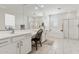Bright bathroom featuring double sinks, a vanity, and a soaking tub at 732 W Flintlock Way, Chandler, AZ 85286