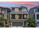 Two-story home featuring a balcony and outdoor living space, complemented by a well-manicured yard at 732 W Flintlock Way, Chandler, AZ 85286