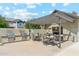 Outdoor grilling area with built-in grills, dining tables and shade structure for alfresco dining at 732 W Flintlock Way, Chandler, AZ 85286