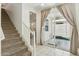 Hallway with tile floor, carpeted stairs, and sliding glass doors that lead to the backyard at 732 W Flintlock Way, Chandler, AZ 85286