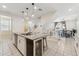 Open kitchen layout featuring a central island with seating and modern appliances at 732 W Flintlock Way, Chandler, AZ 85286