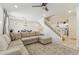 Open concept living room with a sectional sofa, staircase, and access to the dining area at 732 W Flintlock Way, Chandler, AZ 85286